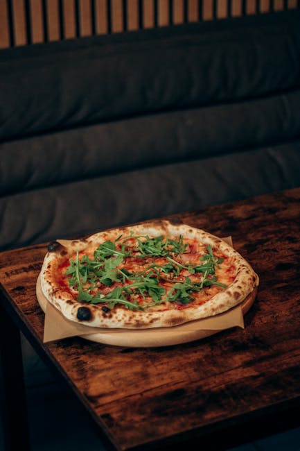 Fresh ingredients and a notebook on a table, representing the planning stage of a food concept.